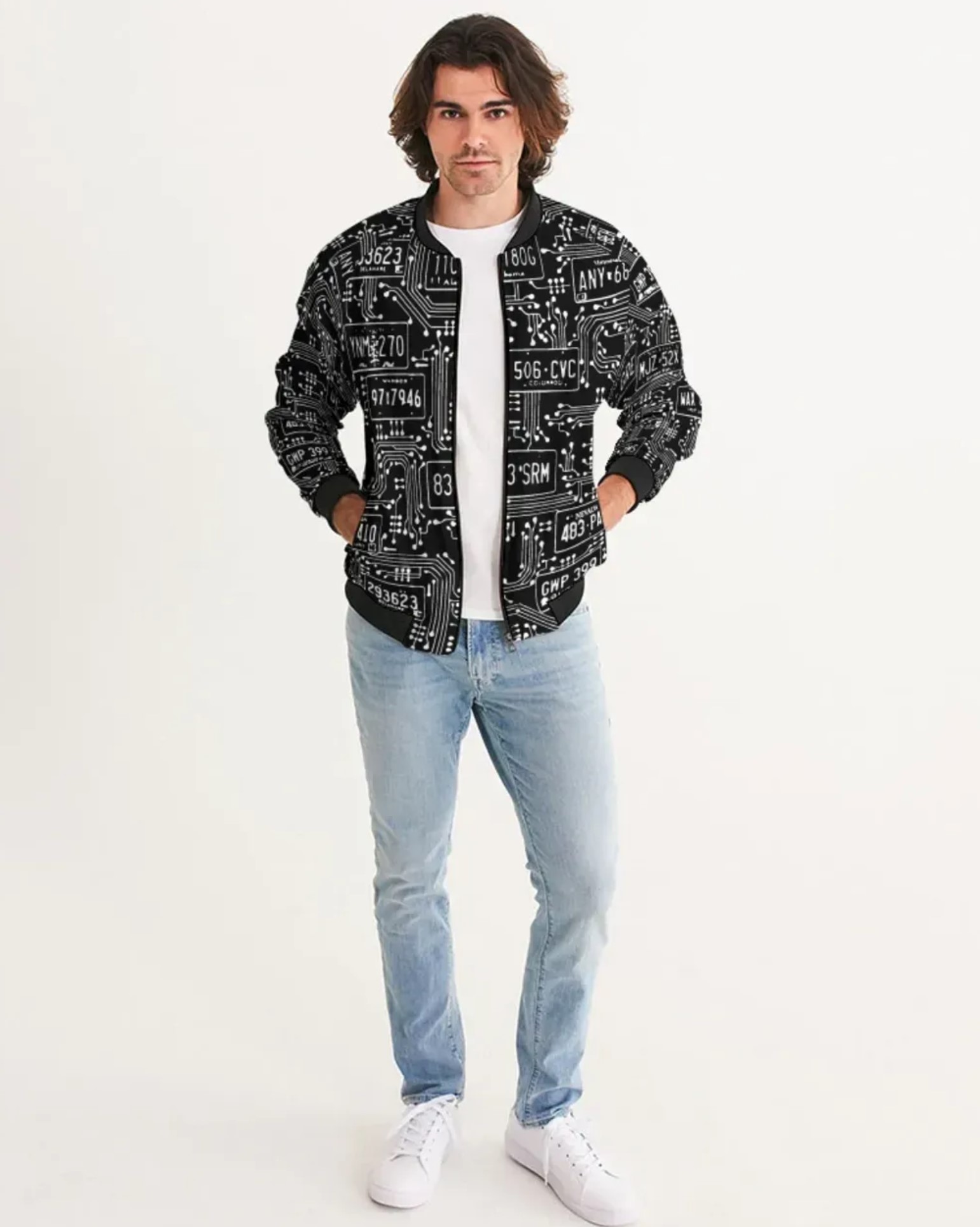 Man wearing a black and white bomber jacket with license plate patterns